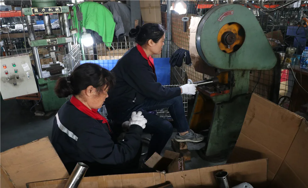factory of Xinkun company with two workers in the picture